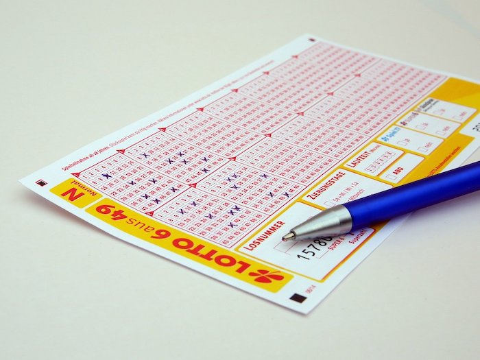 Two men arrested for pasting winning numbers onto a losing lottery ticket