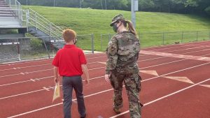 Double the celebration: Military mom surprises son at 6th grade graduation
