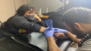 Columbus business hosts first annual Toys for Tattoos