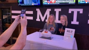 Bengals head coach presents game ball to local bars