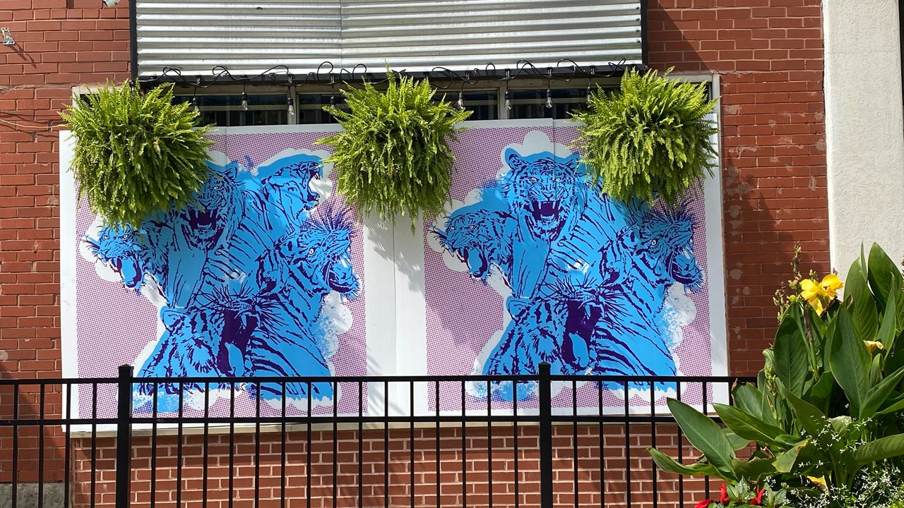 Artists aim to transform Akron’s shattered downtown storefronts into works that inspire