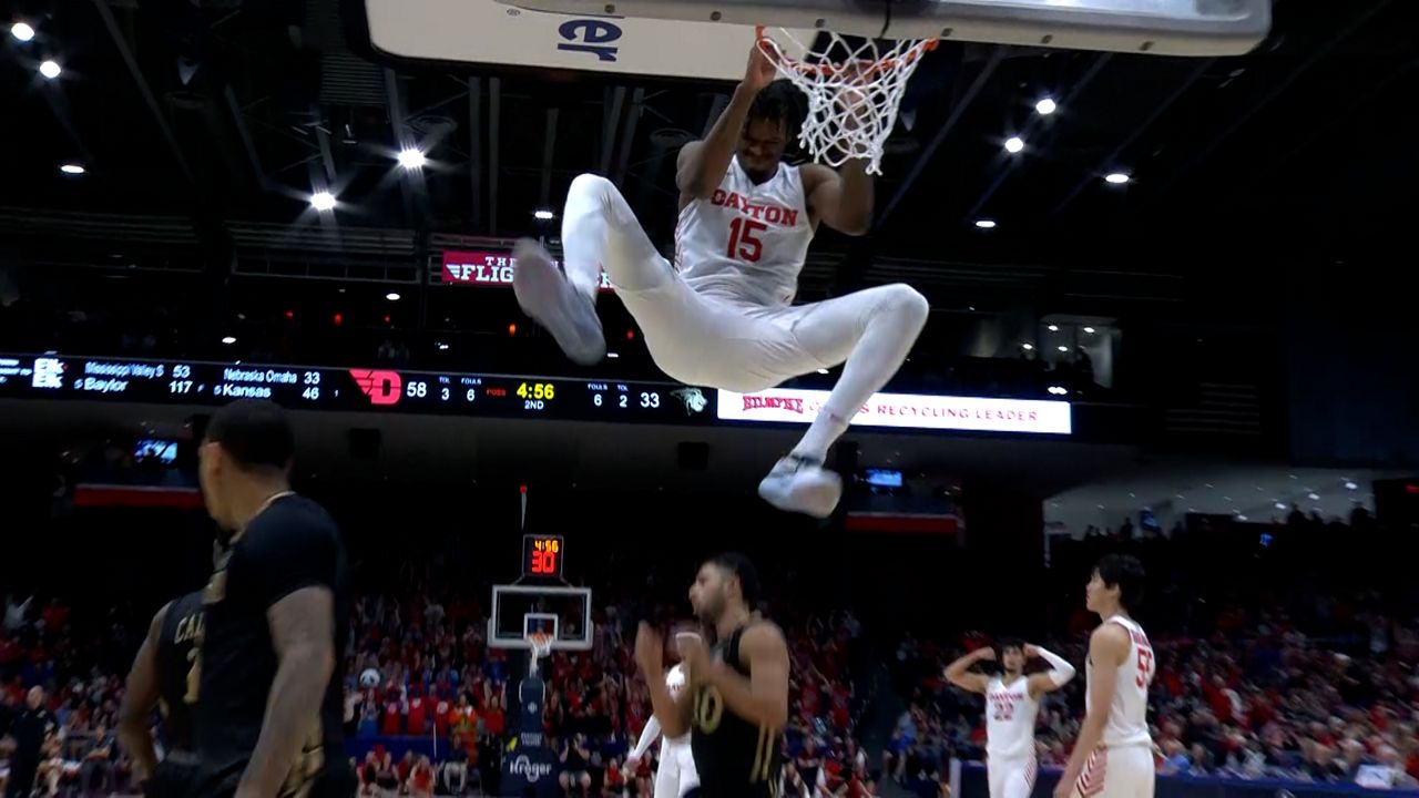 DaRon Holmes helps lift the Dayton Flyers